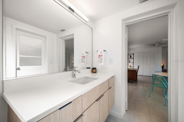 bathroom featuring ceiling fan, visible vents, tile patterned flooring, and vanity