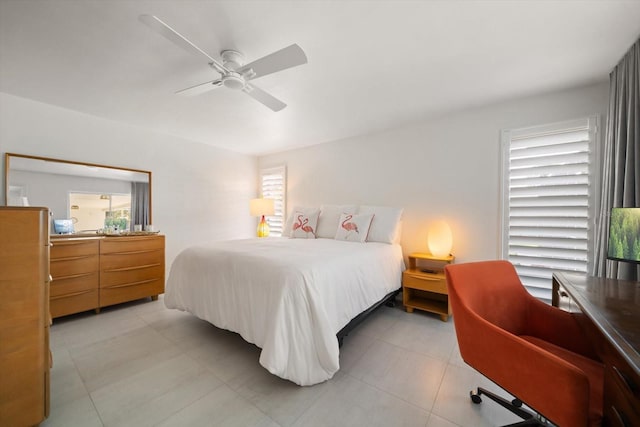 bedroom with light tile patterned floors and a ceiling fan