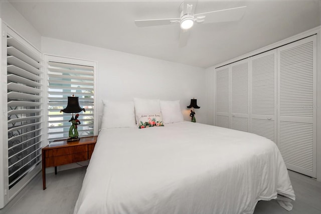 bedroom with ceiling fan and a closet