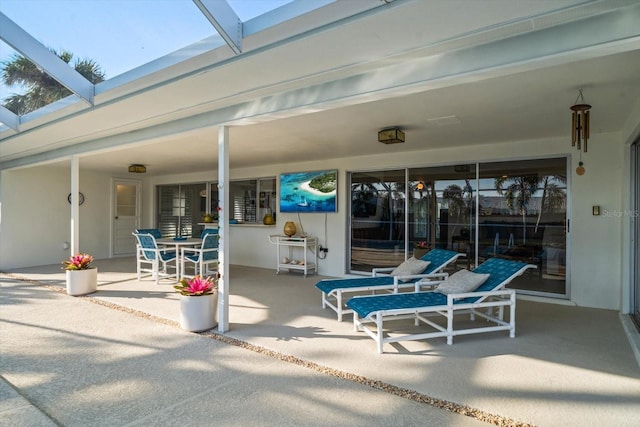 view of patio / terrace with a lanai