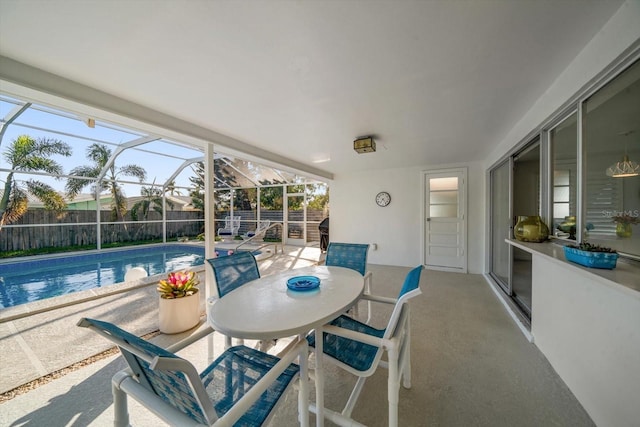 view of patio with a fenced in pool, a lanai, and a fenced backyard