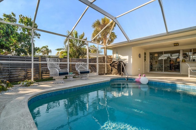 view of swimming pool featuring fence and a fenced in pool