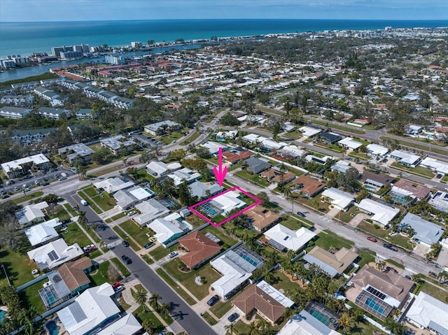 drone / aerial view with a residential view and a water view