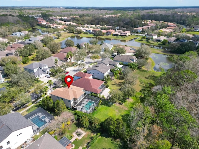 birds eye view of property featuring a water view and a residential view