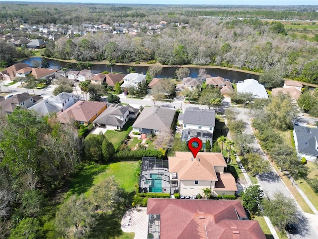 birds eye view of property with a water view and a residential view