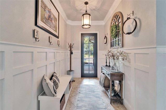 mudroom featuring a wainscoted wall, a decorative wall, and crown molding