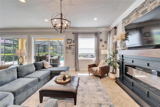 living room with light tile patterned floors, a sunroom, crown molding, a textured ceiling, and a fireplace