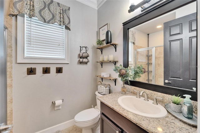 full bath with baseboards, toilet, ornamental molding, vanity, and a shower stall