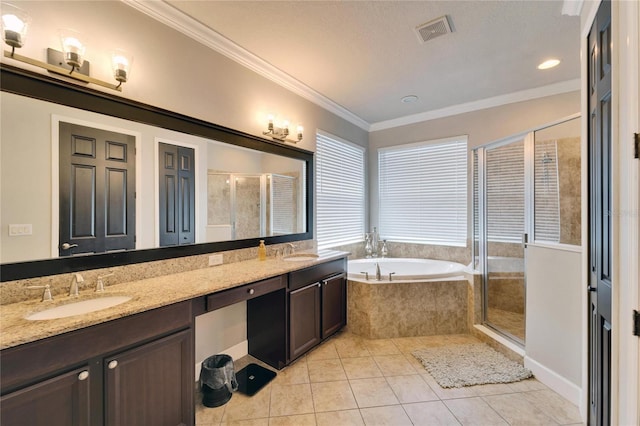 full bathroom featuring a bath, crown molding, visible vents, and a sink