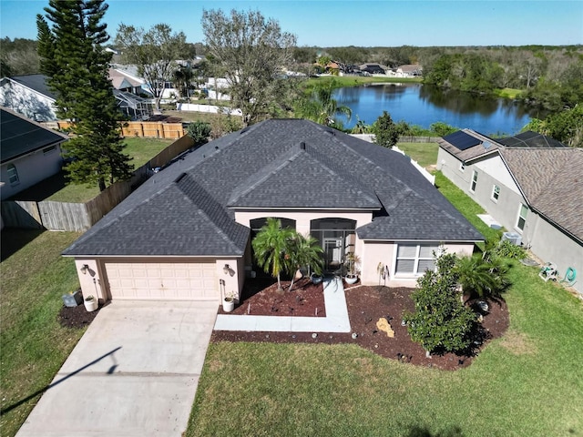 birds eye view of property with a water view