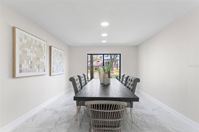 dining area with marble finish floor, baseboards, and recessed lighting