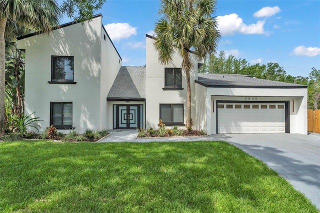 4520 Pine Hollow Dr, Tampa, FL 33624 - view of front facade featuring driveway, a garage, stucco siding, and roof with shingles