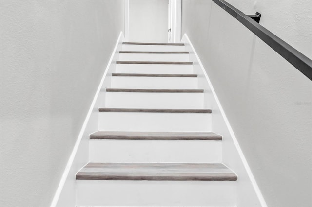 4520 Pine Hollow Dr, Tampa, FL 33624 - staircase featuring a textured wall