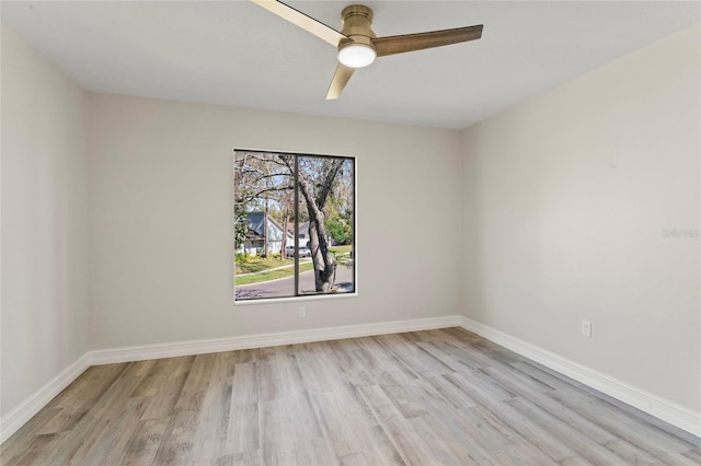 4520 Pine Hollow Dr, Tampa, FL 33624 - unfurnished room featuring light wood-style flooring, a ceiling fan, and baseboards