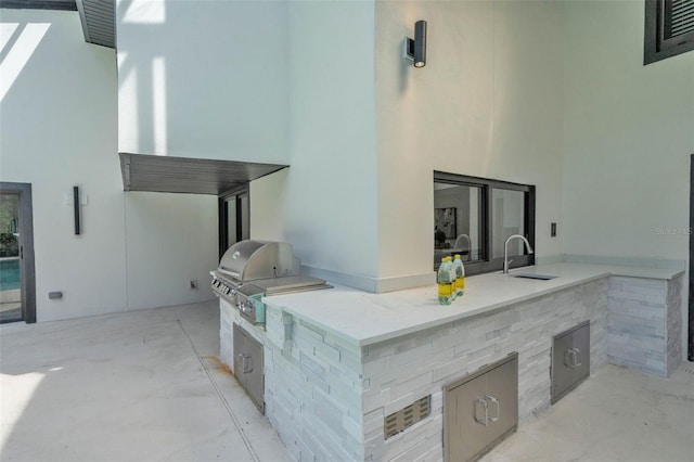 4520 Pine Hollow Dr, Tampa, FL 33624 - view of patio / terrace featuring a sink, exterior kitchen, and a grill