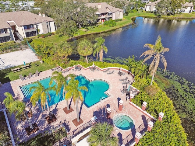 drone / aerial view with a residential view and a water view