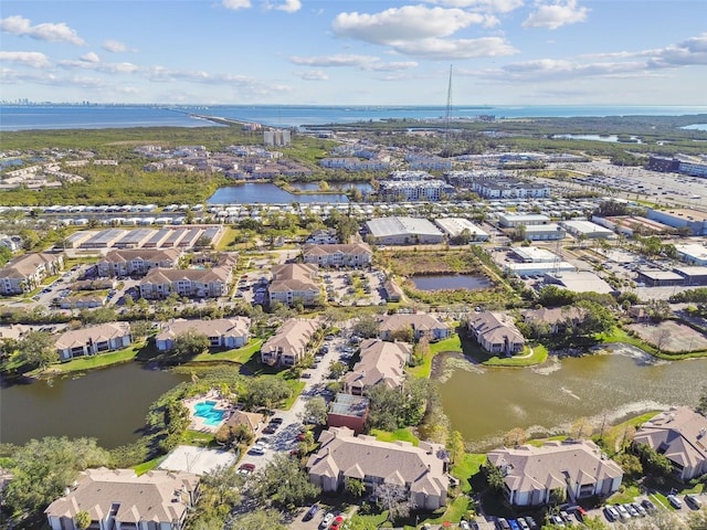 birds eye view of property featuring a water view and a residential view