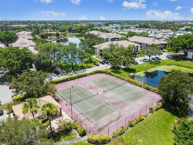 bird's eye view featuring a water view and a residential view