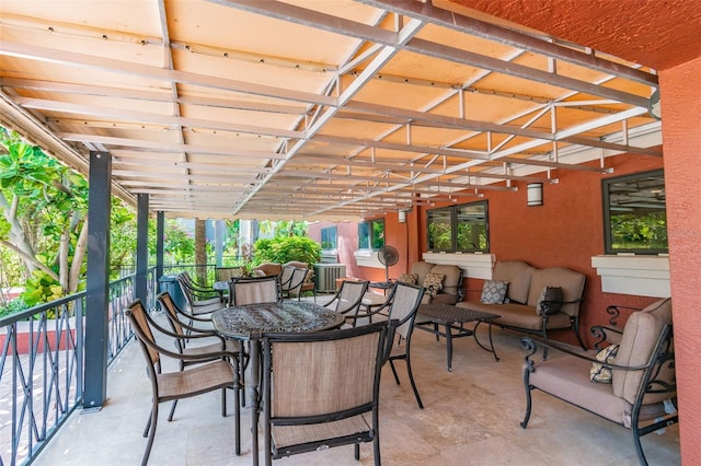 view of patio with outdoor dining space and outdoor lounge area