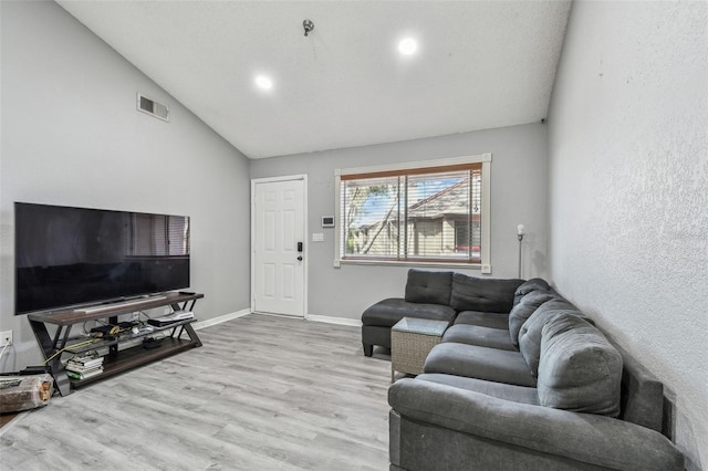 10263 Gandy Blvd N Unit 2014, Saint Petersburg, FL 33702 - living room featuring vaulted ceiling, baseboards, visible vents, recessed lighting, and wood finished floors