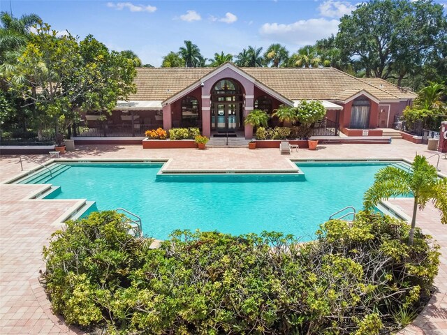 10263 Gandy Blvd N Unit 2014, Saint Petersburg, FL 33702 - pool with a patio area and french doors