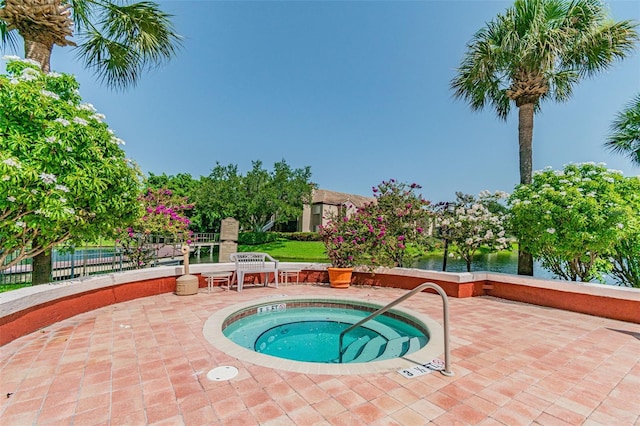 10263 Gandy Blvd N Unit 2014, Saint Petersburg, FL 33702 - view of swimming pool featuring a hot tub, a patio, and fence