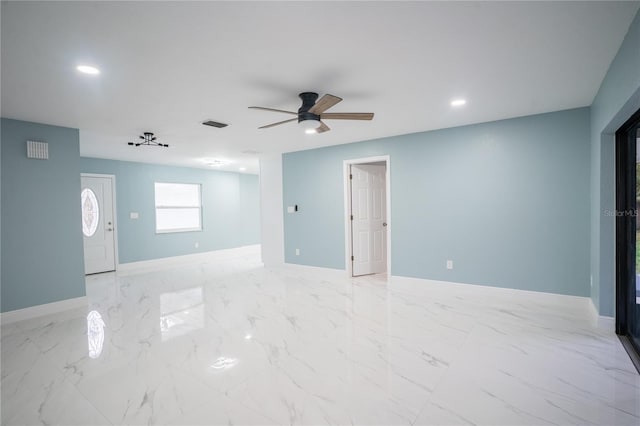 empty room featuring marble finish floor, recessed lighting, visible vents, ceiling fan, and baseboards