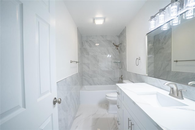bathroom featuring marble finish floor, tile walls, shower / bath combination, toilet, and vanity