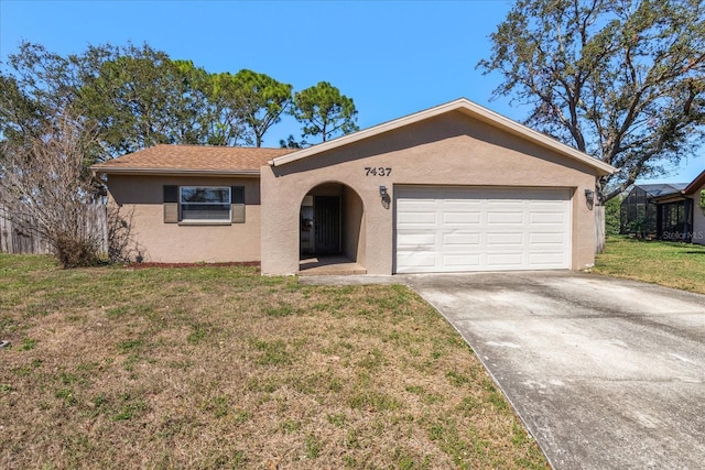 single story home featuring a garage, a front yard, concrete driveway, and stucco siding