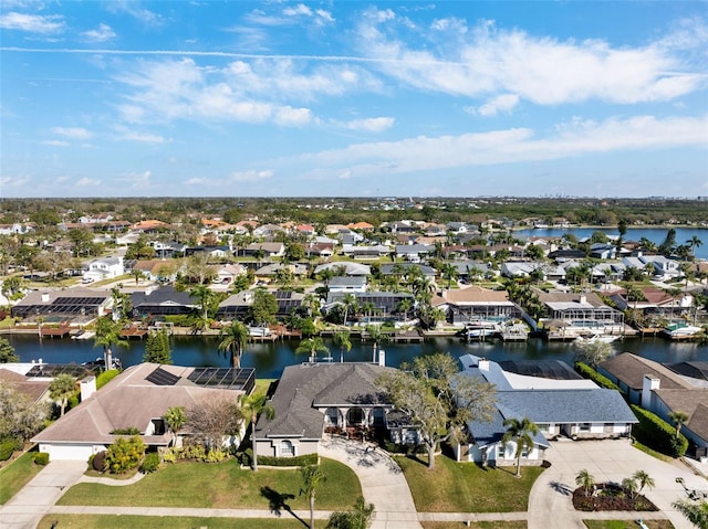 bird's eye view featuring a residential view and a water view