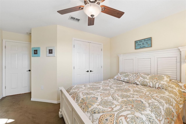 bedroom featuring dark colored carpet, a closet, visible vents, ceiling fan, and baseboards