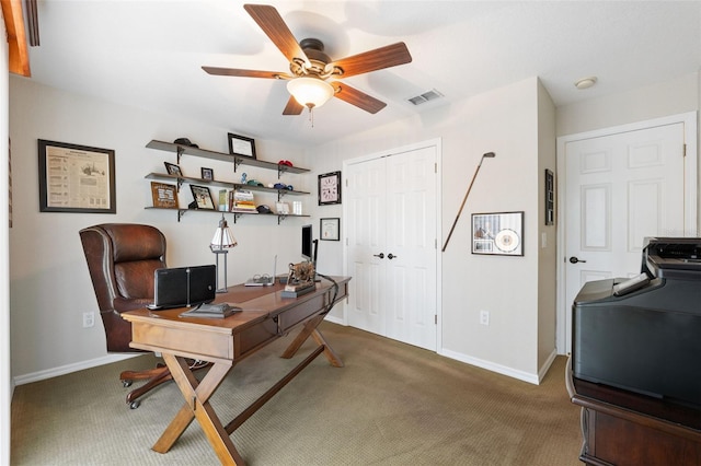 home office featuring visible vents, carpet flooring, ceiling fan, washer / dryer, and baseboards