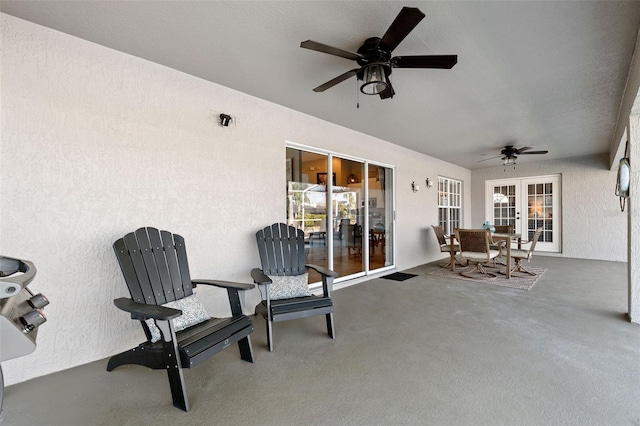 view of patio / terrace featuring french doors and ceiling fan