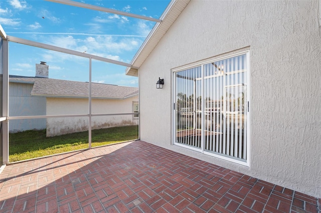 view of patio with a lanai