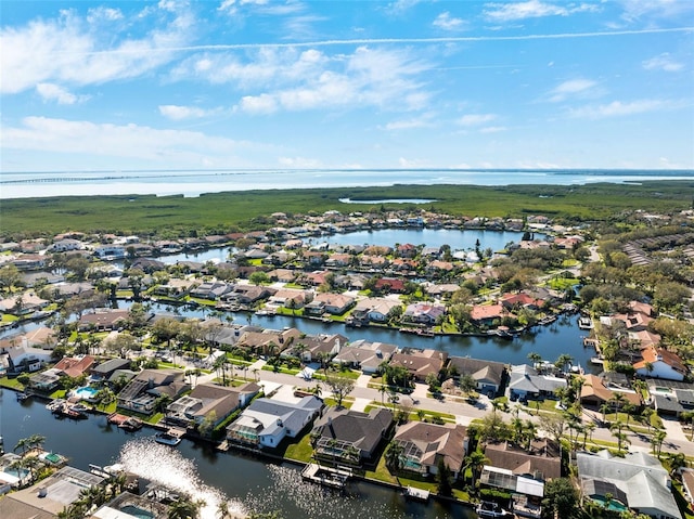 birds eye view of property featuring a water view and a residential view