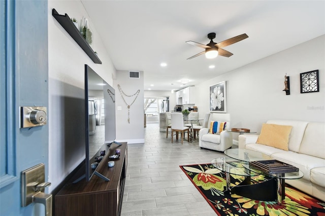 living room with recessed lighting, wood finish floors, visible vents, baseboards, and a ceiling fan