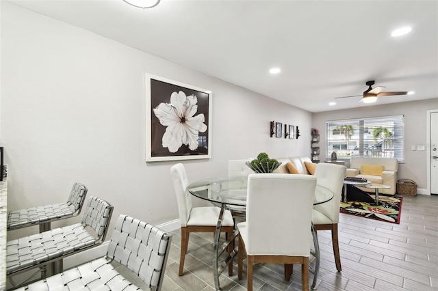 dining area with recessed lighting, ceiling fan, baseboards, and wood tiled floor