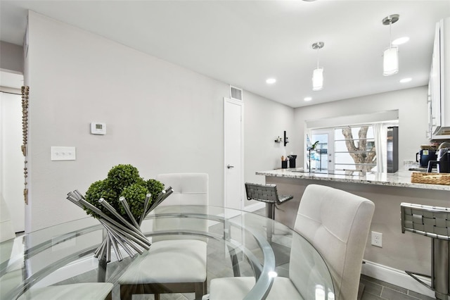 dining room with recessed lighting, french doors, visible vents, and baseboards