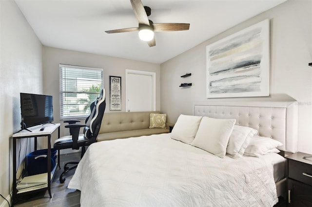 bedroom featuring a ceiling fan and wood finished floors