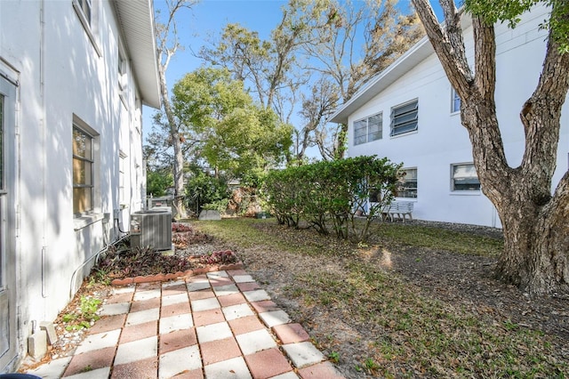 view of yard with central AC