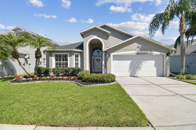 ranch-style home with stucco siding, an attached garage, concrete driveway, and a front yard