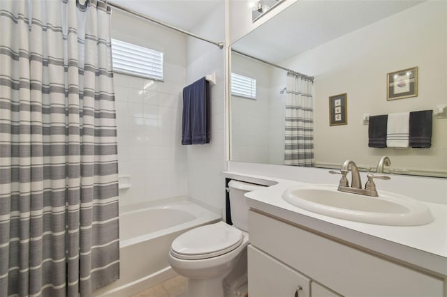 bathroom featuring tile patterned floors, vanity, toilet, and shower / tub combo