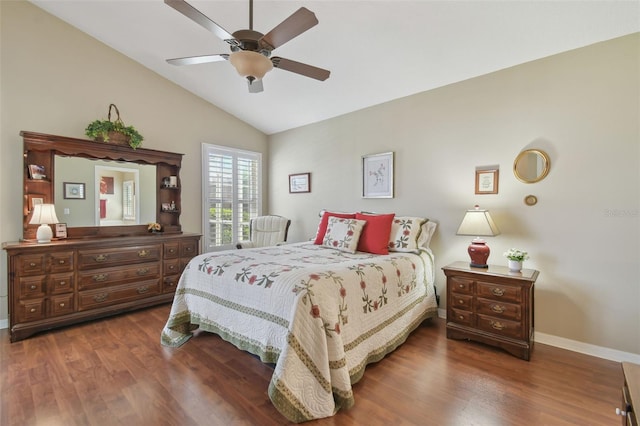 bedroom with vaulted ceiling, a ceiling fan, baseboards, and wood finished floors