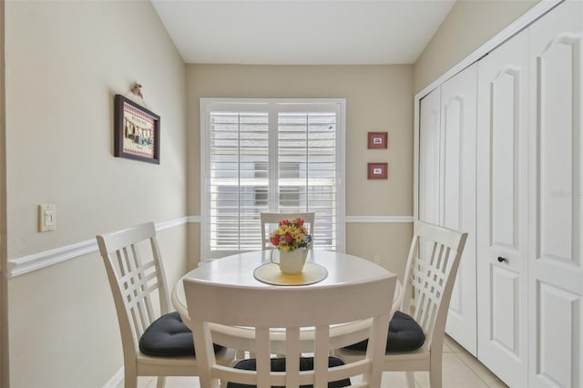 dining area featuring light tile patterned floors