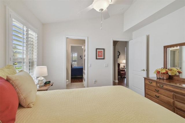 bedroom with lofted ceiling and ceiling fan