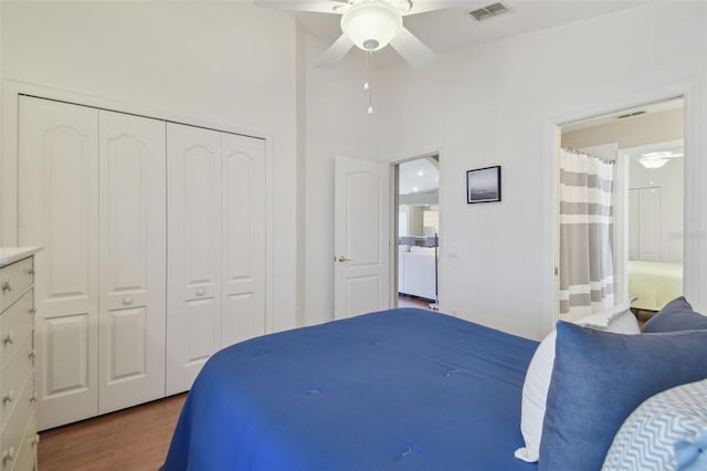 bedroom featuring visible vents, a ceiling fan, ensuite bath, wood finished floors, and a closet