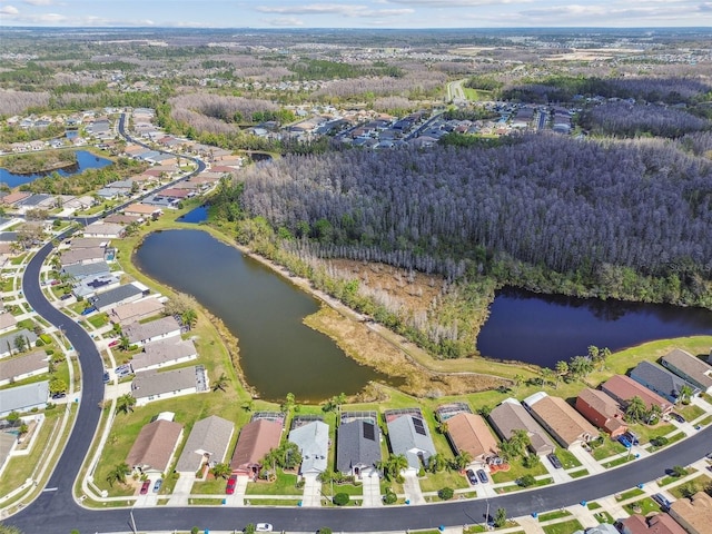 birds eye view of property featuring a water view and a residential view