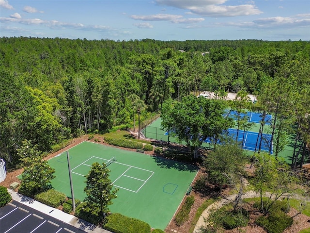 drone / aerial view featuring a view of trees