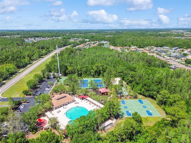 birds eye view of property with a forest view