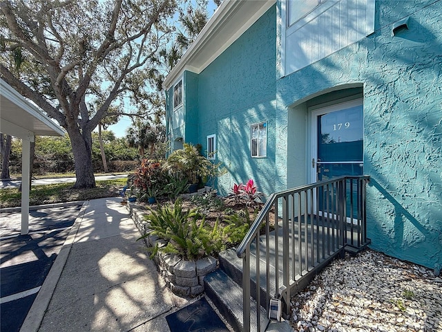 view of property exterior with stucco siding